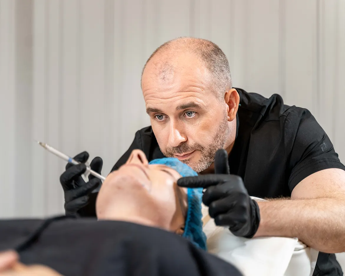 Dr Cormac Lynch treating a patient